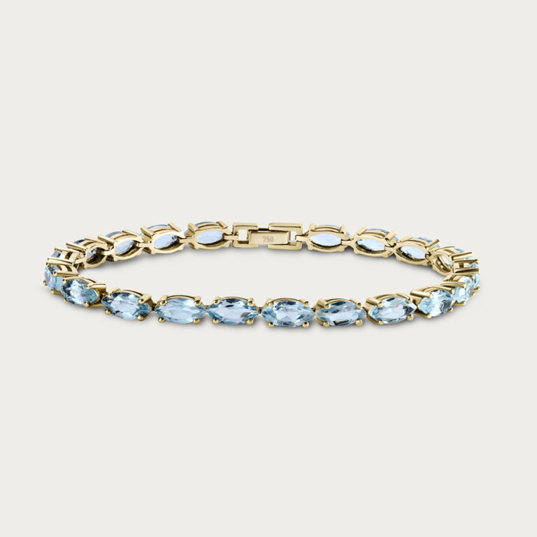 Tennis bracelet with blue topaz