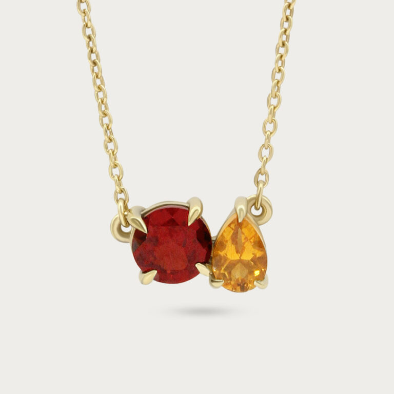 Necklace set with two gemstones side by side