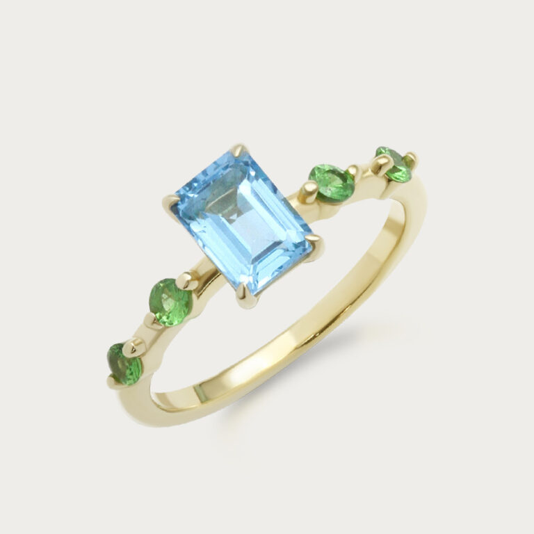 Ring set with an octagon centre stone and four round stones