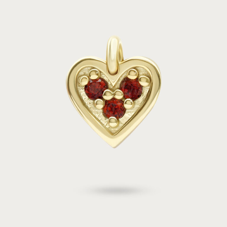 Gold heart charm set with three stones