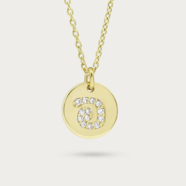 Engraved pendant lined with pave set stones