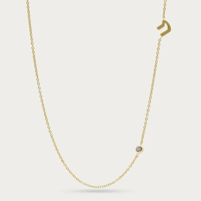 Letter K initial pendant with a stone set beside the letter